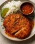 Coconut-breaded chicken katsu with chili-lime sauce and jasmine rice