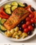 “Mediterranean-style garlic salmon with lemon, herbs, and roasted vegetables”