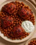 Recipe card for Spicy Harissa Chicken Thighs with Roasted Chickpeas and Herbed Yogurt Sauce